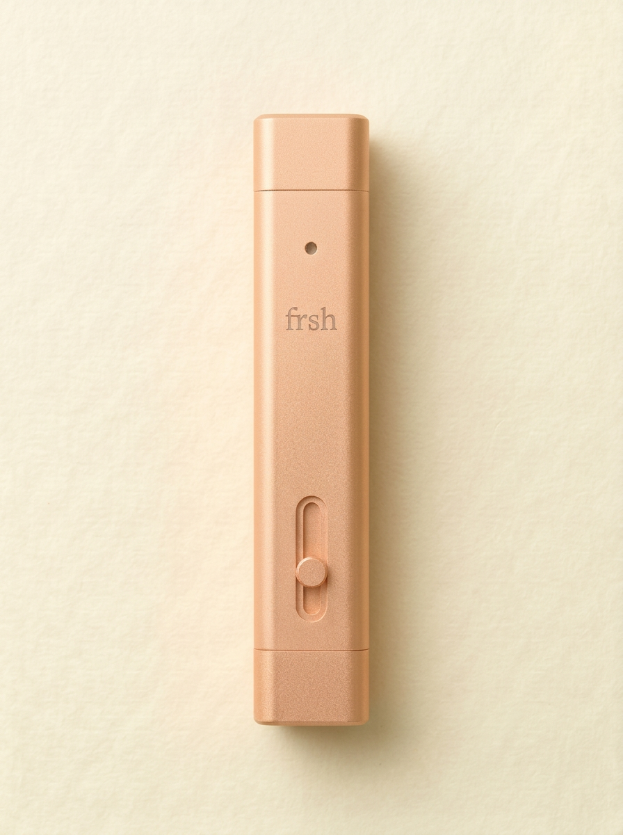 frsh Citrus — butter yellow dual-end mouth spray and lip balm stick on cream paper