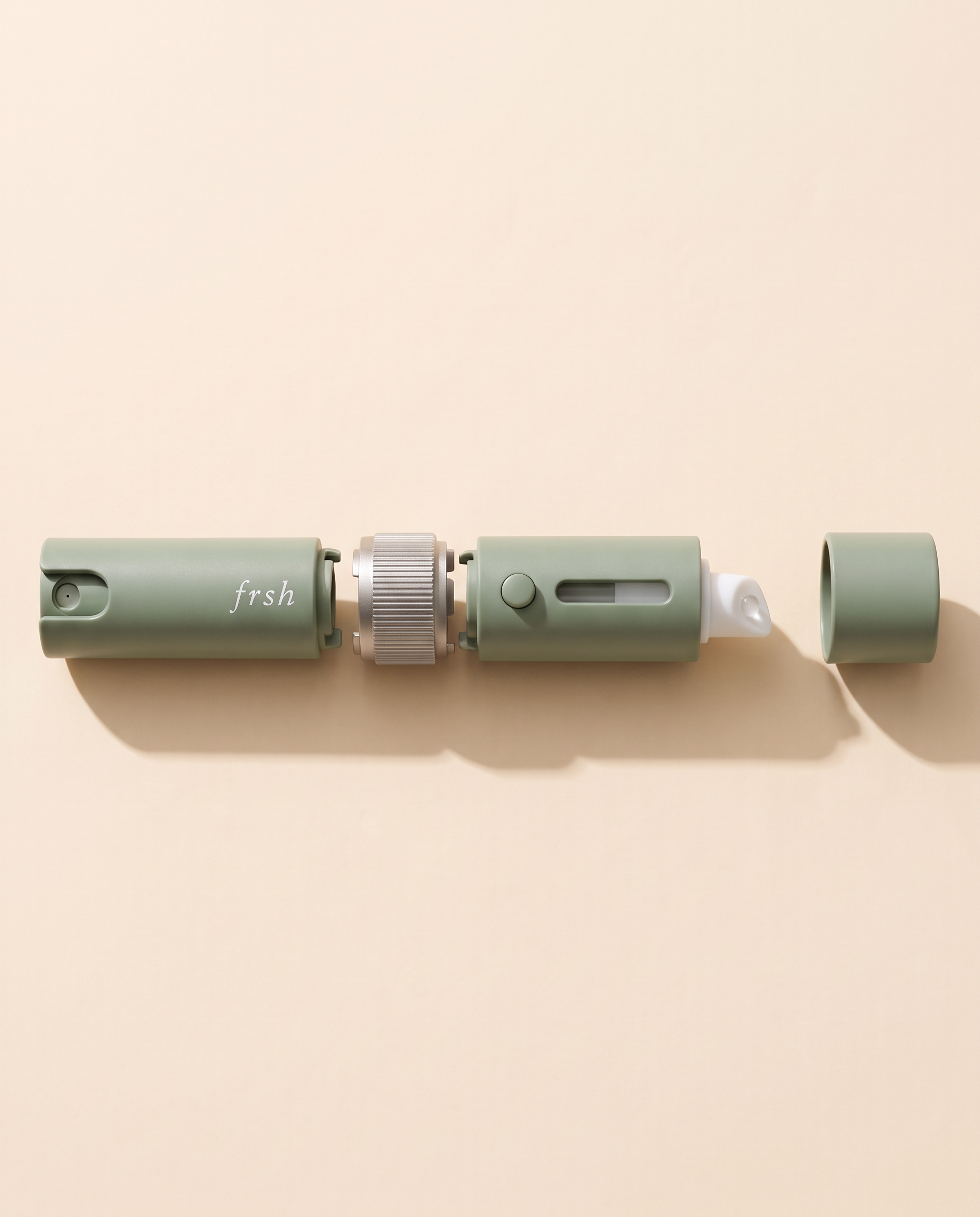 Exploded view of the spray pod, reusable collar, lip balm pod, and single cap